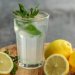 lime juice on drinking glass beside sliced limes